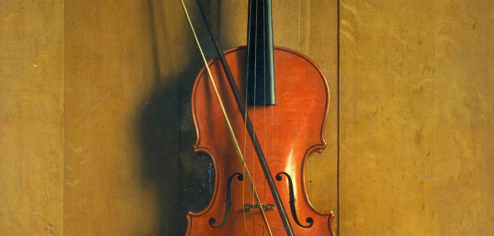 Trompe l'oeil of a violin and bow hanging on a door